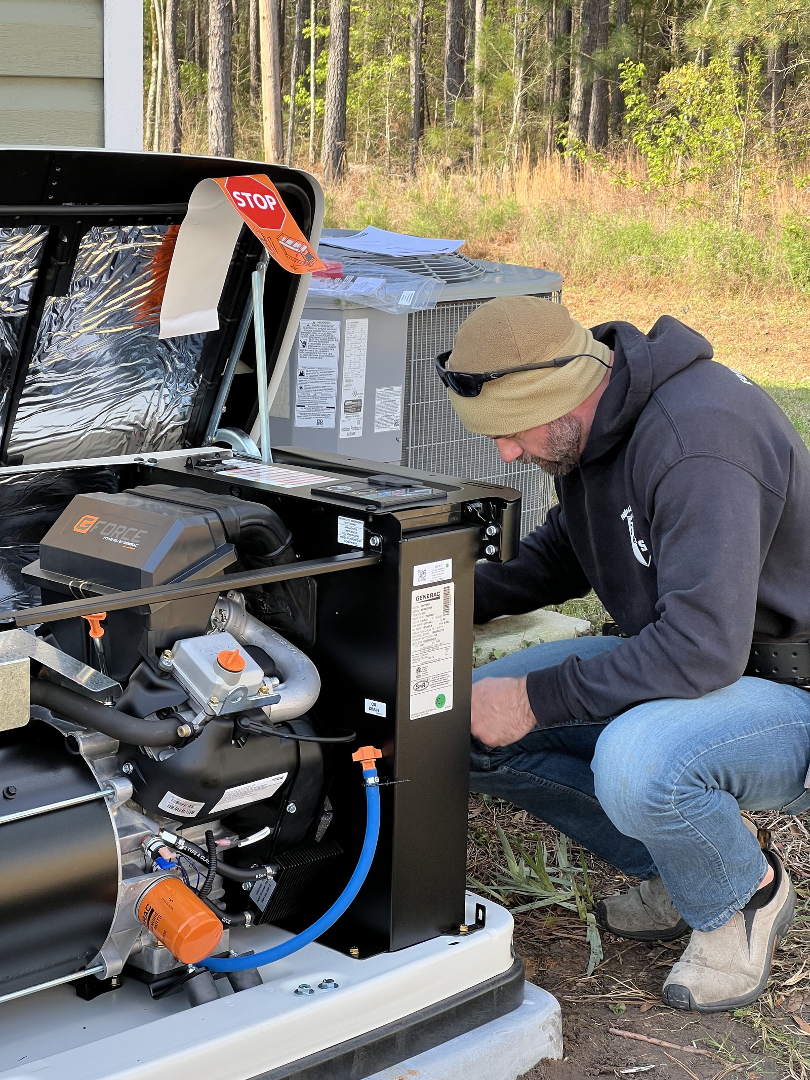 Fogle & Sons Electric technician with the company van — serving Elgin, SC