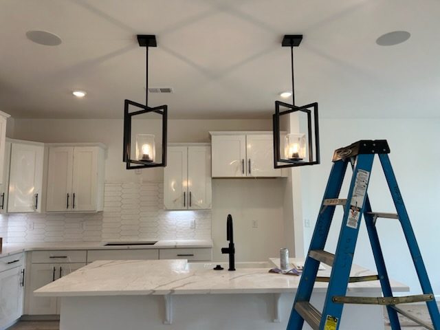 Kitchen pendant light fixture installation by Fogle & Sons Electric