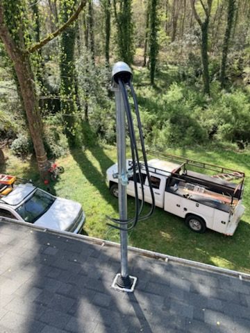 Overhead service mast installed for an electrical service upgrade by Fogle & Sons Electric