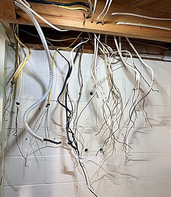 Tangled, unsecured wiring diagnosed during a troubleshooting and repair visit by Fogle & Sons Electric